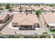 An aerial perspective of the home featuring its tile roof, covered patio, and xeriscaped backyard at 5704 Owl Butte Ct, Las Vegas, NV 89149