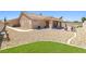 Spacious backyard with covered patio, desert landscaping, and room to relax at 5704 Owl Butte Ct, Las Vegas, NV 89149