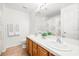 Bright bathroom with double sinks and vanity with a separate toilet and shower at 5704 Owl Butte Ct, Las Vegas, NV 89149