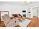 Comfortable living room features a fireplace and neutral decor for a cozy atmosphere at 5704 Owl Butte Ct, Las Vegas, NV 89149
