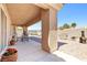 Covered patio with an outdoor dining table and chairs, perfect for entertaining at 5704 Owl Butte Ct, Las Vegas, NV 89149