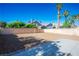 Spacious backyard with a stone surface, offering ample space for outdoor activities at 5984 Emerald Canyon Dr, Las Vegas, NV 89142