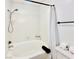 Clean bathroom featuring a white bathtub with shower and toiletries at 5984 Emerald Canyon Dr, Las Vegas, NV 89142