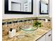 Bathroom featuring granite counters, glass bowl sink, and a modern faucet at 5984 Emerald Canyon Dr, Las Vegas, NV 89142