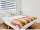 Bedroom with a bed and colorful pillow, creating a cozy and inviting space at 5984 Emerald Canyon Dr, Las Vegas, NV 89142