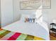 Bright bedroom featuring a bed with colorful blanket and pillow at 5984 Emerald Canyon Dr, Las Vegas, NV 89142