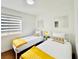 Bedroom with two beds featuring cozy blankets and pillows at 5984 Emerald Canyon Dr, Las Vegas, NV 89142