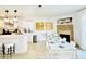 An open-concept dining room adjacent to the kitchen, featuring contemporary decor and ample seating at 5984 Emerald Canyon Dr, Las Vegas, NV 89142