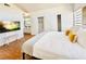 Well-lit bedroom featuring a king-size bed, walk-in closet, and access to a full bathroom at 5984 Emerald Canyon Dr, Las Vegas, NV 89142