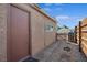 View of backyard with a door and partial fence at 600 Federal St, Henderson, NV 89015