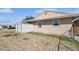 View of house, yard, storage shed, and fence in backyard at 600 Federal St, Henderson, NV 89015