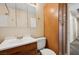 Cozy bathroom features a wood vanity, storage cabinet, and a neutral color scheme at 600 Federal St, Henderson, NV 89015