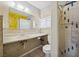 Bathroom featuring a mirrored vanity and updated shower at 600 Federal St, Henderson, NV 89015