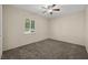 Bedroom with neutral walls, ceiling fan, and carpeted floor at 600 Federal St, Henderson, NV 89015