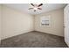 Bedroom with neutral walls, ceiling fan, and carpeted floor at 600 Federal St, Henderson, NV 89015