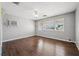 Sunlit bedroom featuring hardwood floors, ceiling fan, and bright windows at 600 Federal St, Henderson, NV 89015