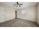 Bedroom with neutral walls, ceiling fan, carpeted floor, and closet at 600 Federal St, Henderson, NV 89015