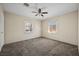 Spacious bedroom with neutral walls, ceiling fan, and carpeted floor at 600 Federal St, Henderson, NV 89015