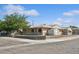 Single story home featuring a chain link fence and a well-manicured lawn at 600 Federal St, Henderson, NV 89015