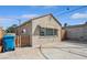 Exterior view of the home's garage with light-colored exterior and a bright blue sky at 600 Federal St, Henderson, NV 89015
