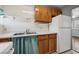 Efficient kitchen layout with ample cabinetry and a stainless steel sink at 600 Federal St, Henderson, NV 89015