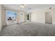 Spacious living room with carpet, ceiling fans and natural light at 600 Federal St, Henderson, NV 89015