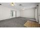 Open living room featuring neutral carpet and plenty of natural light at 600 Federal St, Henderson, NV 89015