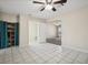 Spacious living room features tile floors, storage shelving, and a view into the front entrance at 600 Federal St, Henderson, NV 89015