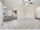 Inviting living room with tile floors, ceiling fan, and open layout to the front door and another room at 600 Federal St, Henderson, NV 89015