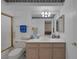 Bathroom with a single sink vanity, toilet, and blue towels on the towel bar at 6804 Elm Creek Dr # 202, Las Vegas, NV 89108