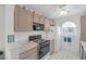 Functional kitchen with white appliances, tile countertops, and ample cabinet space at 6804 Elm Creek Dr # 202, Las Vegas, NV 89108