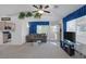 Comfortable living room with neutral carpet, sofa, TV, and access to the kitchen at 6804 Elm Creek Dr # 202, Las Vegas, NV 89108