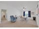 Spacious living room with neutral carpet, a ceiling fan, and comfortable blue armchair at 6804 Elm Creek Dr # 202, Las Vegas, NV 89108
