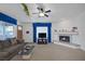 Open living area with fireplace, large TV, and comfortable seating arrangement at 6804 Elm Creek Dr # 202, Las Vegas, NV 89108