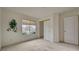 Bedroom with window with neutral coverings and closet with sliding doors at 7232 Vista Bonita Dr, Las Vegas, NV 89149