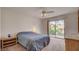 Bedroom with a sliding glass door leading to an outdoor balcony and a ceiling fan at 7232 Vista Bonita Dr, Las Vegas, NV 89149