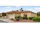 Charming one-story home showcasing well-maintained landscaping, a two-car garage, and a classic red tile roof at 7232 Vista Bonita Dr, Las Vegas, NV 89149