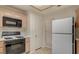 Kitchen features white appliances, gas range, microwave, and plenty of cabinet space at 7232 Vista Bonita Dr, Las Vegas, NV 89149