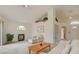 Spacious living room with a vaulted ceiling, fireplace, comfortable seating, and neutral decor at 7232 Vista Bonita Dr, Las Vegas, NV 89149