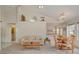 Open-concept living room with vaulted ceiling, dining area, comfortable seating, and natural light at 7232 Vista Bonita Dr, Las Vegas, NV 89149