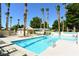 Inviting community pool area with lounge chairs, shade, and lush landscaping at 7232 Vista Bonita Dr, Las Vegas, NV 89149