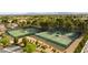 Aerial view of community tennis courts surrounded by mature trees and landscaping in Painted Desert at 7232 Vista Bonita Dr, Las Vegas, NV 89149