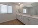This bathroom has a large double sink vanity with cabinets and drawers, and a large mirror at 754 Tallgrass St, Las Vegas, NV 89138