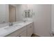 Bathroom boasts double sinks and white vanity cabinets at 754 Tallgrass St, Las Vegas, NV 89138