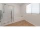 This bathroom features a shower, soaking tub, and a window for plenty of natural light at 754 Tallgrass St, Las Vegas, NV 89138