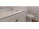Bright bathroom featuring a white vanity with solid surface countertop and brushed nickel hardware at 754 Tallgrass St, Las Vegas, NV 89138