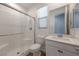 Bathroom features a glass-enclosed shower, white vanity and toilet at 754 Tallgrass St, Las Vegas, NV 89138