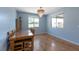 Comfortable dining room with wood floors, a modern chandelier and plenty of natural light at 754 Tallgrass St, Las Vegas, NV 89138