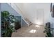 Bright foyer with tile floors, staircase and an aquarium with tropical plants at 754 Tallgrass St, Las Vegas, NV 89138