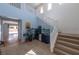 Open foyer featuring a staircase, tile flooring, an aquarium and plenty of natural light at 754 Tallgrass St, Las Vegas, NV 89138